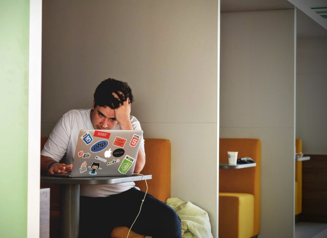 photo of teenager staring at a laptop experiencing school stress