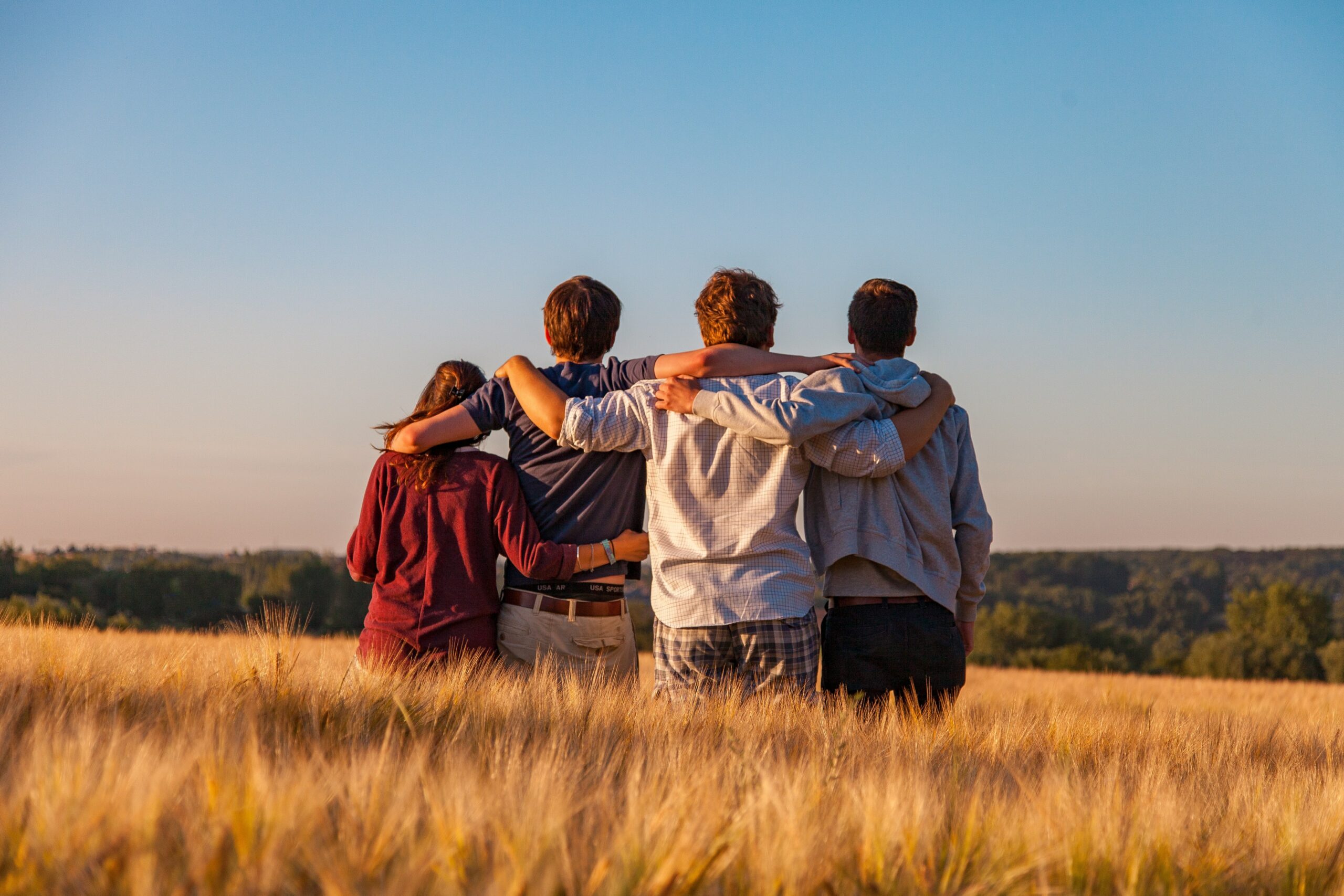 family holding each other and looking at a view, making memories
