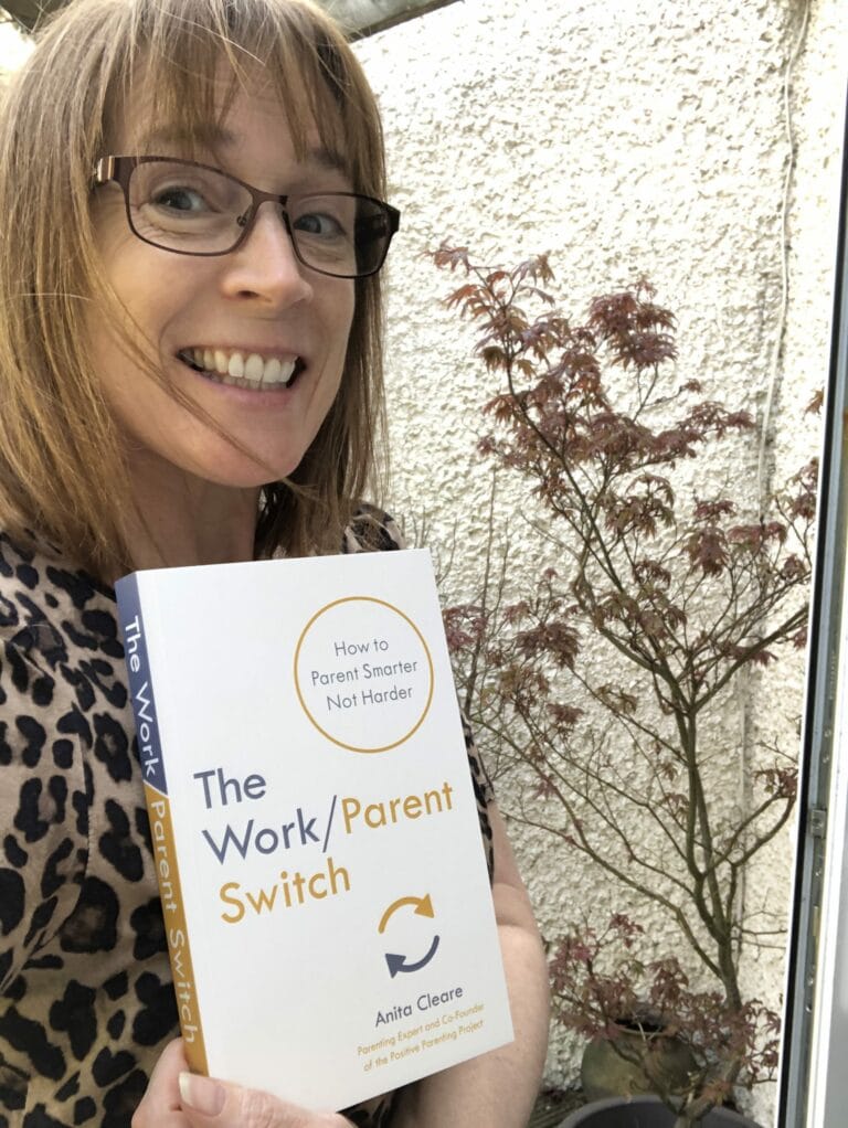 Anita Cleare, parenting expert, holding a copy of her book The Work/Parent Switch