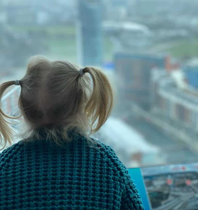 Anita Cleare, parenting expert, @parenting in a time of uncertainty' photo of girl looking over balcony