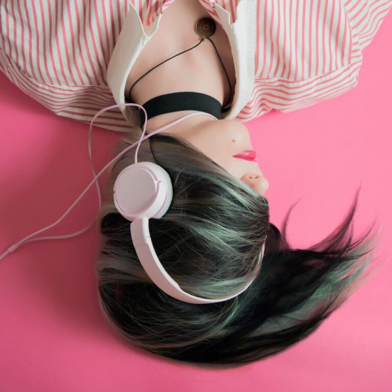 'Getting teenagers into a routine' by parenting expert Anita Cleare - photo of a teenagers lying on the floor listening to music