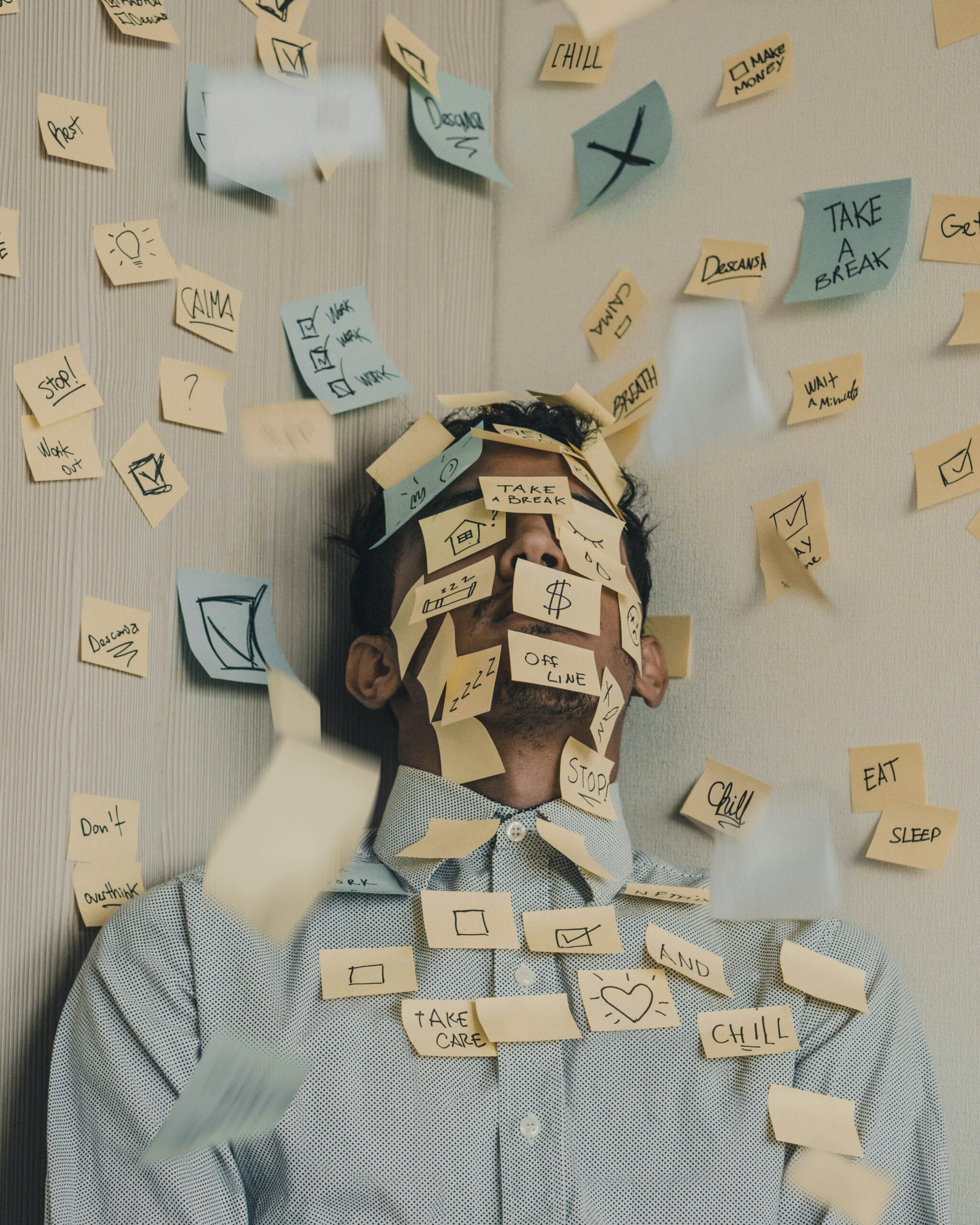 Balancing work and parenting when working from home | Positive Parenting Project Photo of man covered in Post-Its to illustrate article on balancing work and parenting when working from home