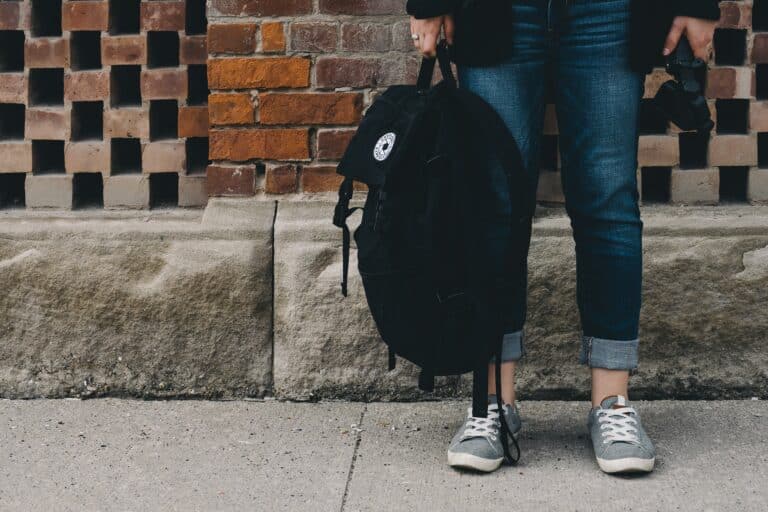 photo of teenager carrying a rucksack