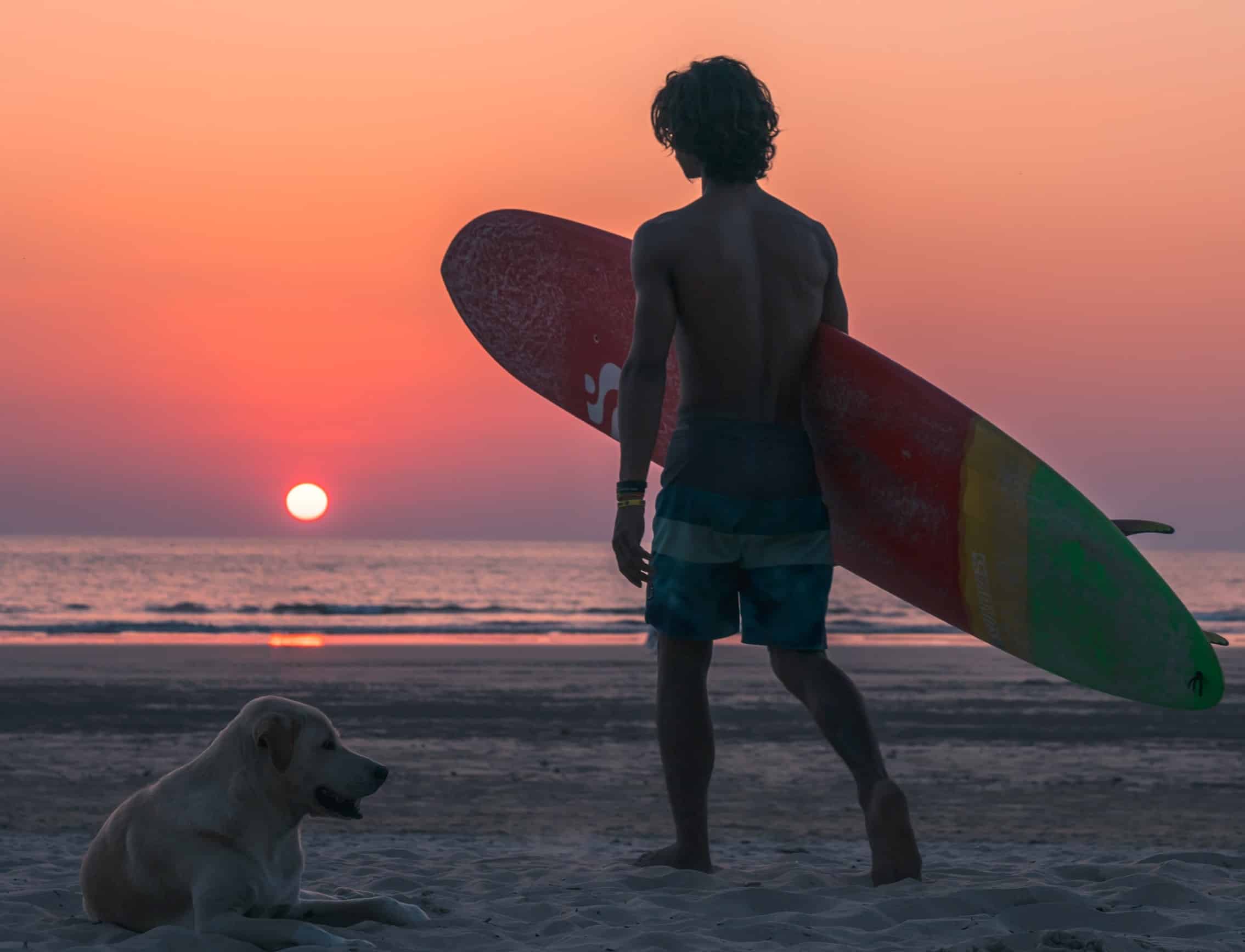 Empathetic listening video guide for parents by parenting expert Anita Cleare, photo of teenager carrying a surf board
