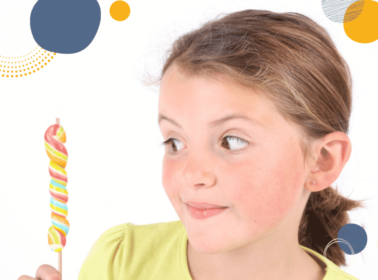 Photo of girl with a lollipop to illustrate article 'What is an accidental reward in parenting?'