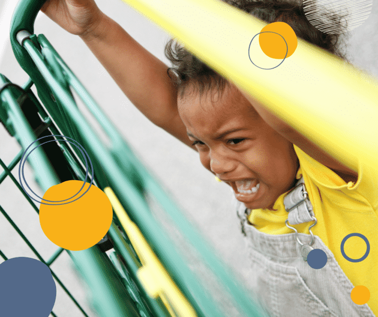 Photo of a young black girl in a yellow top crying and holding on to a shopping trolley to illustrate advice for parents on difficult behaviour when you're out and about
