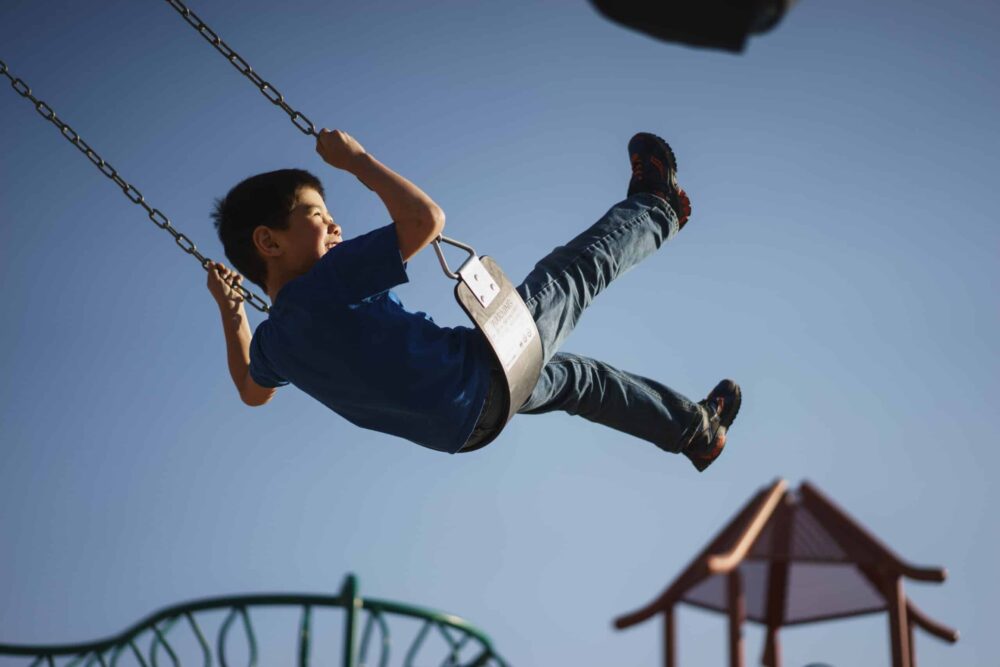 photo of a child on a swing