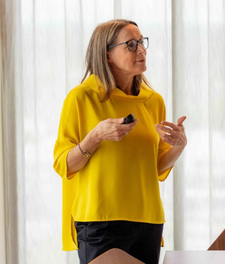 Photo of parenting expert Anita Cleare delivering a parenting seminar in a corporate boardroom
