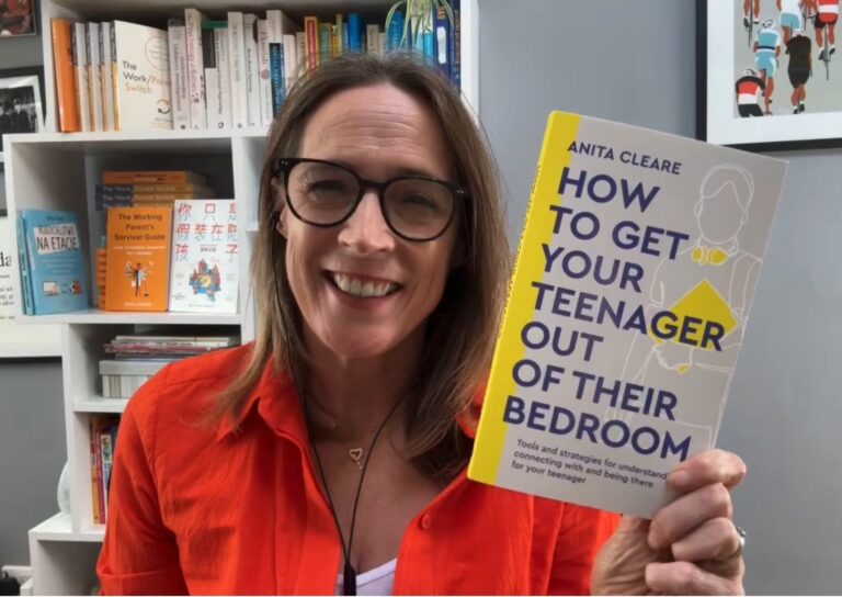 Photo of parenting expert Anita Cleare holding up a copy of her book How to Get Your Teenager Out of Their Bedroom and smiling at the camera taken from a video on How to boost your teen's self-esteem