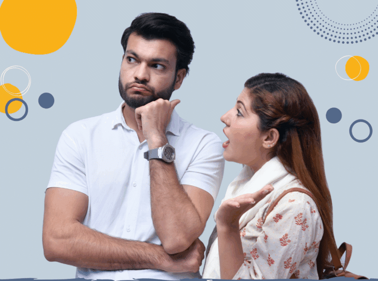 Photo of young Indian woman with long dark hair speaking heatedly to taller Indian man who is looking away (to illustrate article on overcoming different parenting styles)