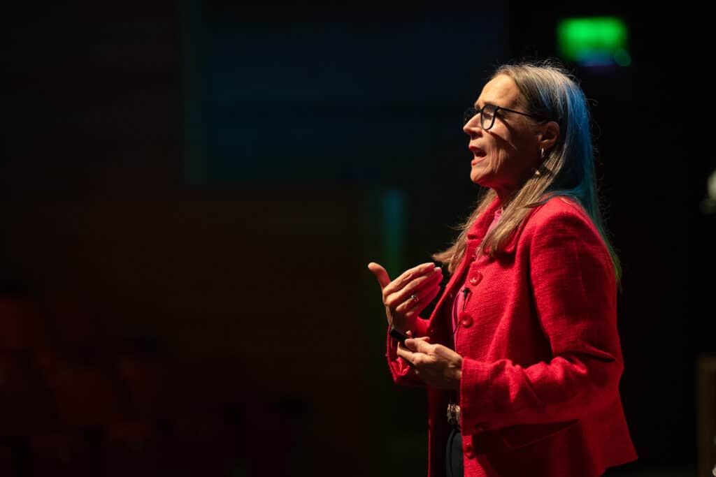 photo of parenting expert Anita Cleare speaking on stage