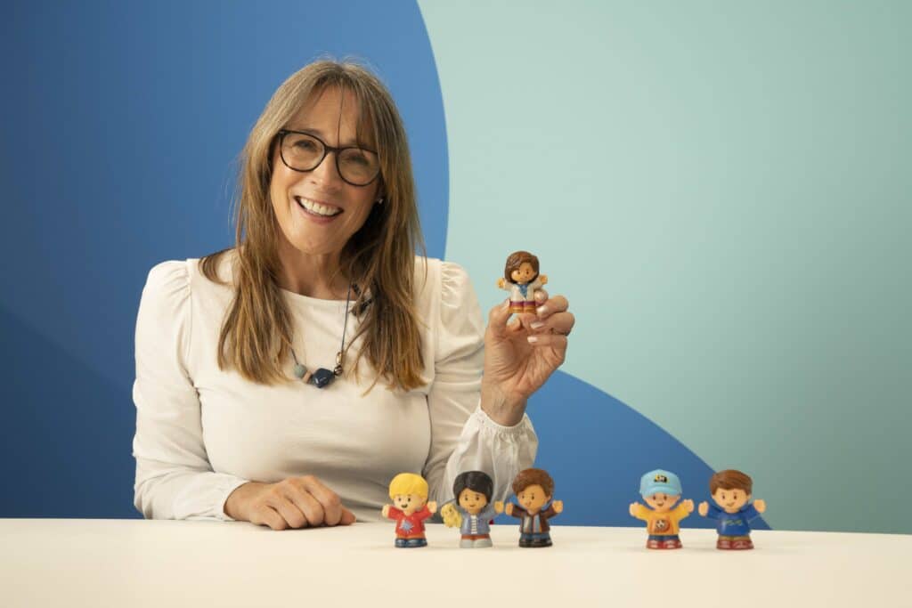 photo of Anita Cleare holding up a toy