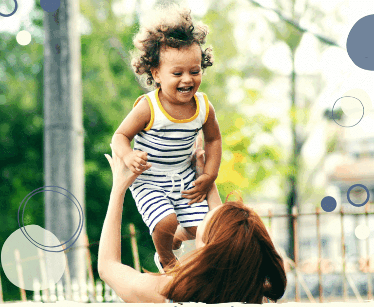 photo of a mum throwing her young smiling son up in the air to illustrate article on how to be a happy working parent
